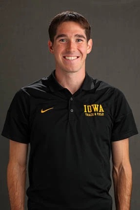 Carson Lane wearing a black Iowa polo